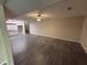 A large basement with dark hardwood floors, neutral walls, and staircase to upper floor at 5544 Whispering Swan Ct, Douglasville, GA 30135