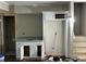 Under-construction basement wet bar with granite countertop and custom white cabinetry at 5544 Whispering Swan Ct, Douglasville, GA 30135
