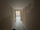 Hallway with view of windows, awaiting final touches at 5544 Whispering Swan Ct, Douglasville, GA 30135