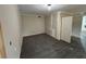 Unfinished basement area with paneled door and wood trim at 5544 Whispering Swan Ct, Douglasville, GA 30135