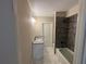 This bathroom features a granite countertop, white cabinets, and a tiled shower/tub at 5544 Whispering Swan Ct, Douglasville, GA 30135
