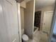 This bathroom features marble floors, neutral walls, and a tiled shower/tub at 5544 Whispering Swan Ct, Douglasville, GA 30135