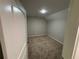 A carpeted bedroom featuring light gray walls and a bright light at 5544 Whispering Swan Ct, Douglasville, GA 30135