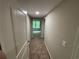 Hallway featuring carpet flooring and neutral colored walls at 5544 Whispering Swan Ct, Douglasville, GA 30135
