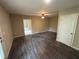 A spacious living room with hardwood floors and lots of natural light at 5544 Whispering Swan Ct, Douglasville, GA 30135