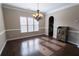 Bright dining room with hardwood floors, chandelier, and built-in hutch at 4162 Roberts Crest Dr, Suwanee, GA 30024