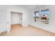 Bright living room with light wood floors, white walls, and french doors to other rooms with lots of natural light at 41 Bennett Farm Dr, Loganville, GA 30052