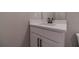 Elegant bathroom vanity with quartz countertop and black hardware at 63 Youth Jersey Rd, Covington, GA 30014
