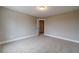 Bedroom featuring natural light, a large window and neutral colored walls and carpet at 63 Youth Jersey Rd, Covington, GA 30014