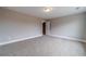 Neutral bedroom with plush carpet and doorway to hallway at 63 Youth Jersey Rd, Covington, GA 30014