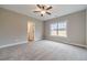 Spacious bedroom with plush carpeting, a large window for natural light, and neutral paint at 63 Youth Jersey Rd, Covington, GA 30014