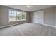 Bedroom with natural light, double door closet and large window featuring neutral walls and carpeting at 63 Youth Jersey Rd, Covington, GA 30014