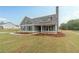 Lovely home exterior with green siding, charming shutters, and manicured lawn at 63 Youth Jersey Rd, Covington, GA 30014