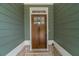 Charming wood front door with glass pane and sidelight at 63 Youth Jersey Rd, Covington, GA 30014