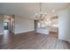Modern open-concept kitchen area showcasing an island, white cabinets, and ample space at 63 Youth Jersey Rd, Covington, GA 30014