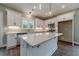 Beautiful kitchen featuring white cabinets, stainless appliances, and a central island at 63 Youth Jersey Rd, Covington, GA 30014