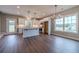 Open-concept kitchen featuring white cabinetry, an island, and modern lighting at 63 Youth Jersey Rd, Covington, GA 30014
