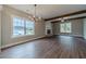 Spacious living room with wood floors, neutral walls, and abundant natural light at 63 Youth Jersey Rd, Covington, GA 30014