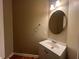 Clean bathroom with a vanity, large mirror and hardwood floors at 1824 Thornhill Se Pass, Conyers, GA 30013