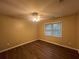 Simple bedroom with hardwood floors and ceiling fan at 1824 Thornhill Se Pass, Conyers, GA 30013