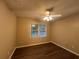 Simple bedroom with hardwood floors and a ceiling fan at 1824 Thornhill Se Pass, Conyers, GA 30013