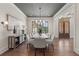 Elegant dining room features coffered ceilings, stylish lighting, and seating for eight guests at 11 Brownson Ct, Acworth, GA 30101