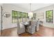 Bright dining room with large windows, modern lighting, and seating for six guests at 11 Brownson Ct, Acworth, GA 30101