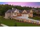 Stunning brick home featuring a three-car garage, manicured lawn, and elegant landscaping with privacy wall at 11 Brownson Ct, Acworth, GA 30101