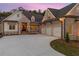 Brick home with a three-car garage and a welcoming front porch at 11 Brownson Ct, Acworth, GA 30101