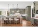 Spacious kitchen with custom cabinets, an expansive island with seating, and modern appliances at 11 Brownson Ct, Acworth, GA 30101