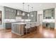 Modern kitchen featuring gray cabinetry, a center island with seating, and stainless steel appliances at 11 Brownson Ct, Acworth, GA 30101