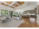 Open-concept living room and kitchen with coffered ceilings and expansive windows for natural light at 11 Brownson Ct, Acworth, GA 30101