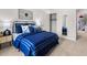 Bedroom with blue bedding, closet, and playful decor at 6098 Zephyr Ln, Mableton, GA 30126