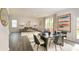 Open concept dining area with dark wood table and hardwood floors at 6098 Zephyr Ln, Mableton, GA 30126