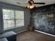 Unique bedroom with a chalkboard wall and a large window providing natural light at 989 Park Knoll Ct, Lawrenceville, GA 30043
