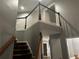 Open hallway with wood railing offers a glimpse of the house's layout and modern design at 989 Park Knoll Ct, Lawrenceville, GA 30043