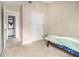 This bedroom features neutral walls and opens to the hallway and an ensuite bath at 5100 Windsor Forrest Ln, Atlanta, GA 30349
