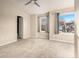 Spacious bedroom with neutral carpet, natural light from two windows, and a door to an en-suite bathroom at 5100 Windsor Forrest Ln, Atlanta, GA 30349