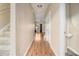 Inviting hallway featuring hardwood floors, neutral walls, and a view into the living area, showcasing the home's open layout at 5100 Windsor Forrest Ln, Atlanta, GA 30349