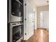 Convenient laundry area with stacked washer and dryer, plus easy access to the home's entrance at 5100 Windsor Forrest Ln, Atlanta, GA 30349