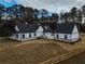 Aerial view showcasing a farmhouse with detached garage and large backyard at 2259 County Line Rd, Acworth, GA 30101