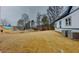 Open backyard with new sod and a view of neighboring properties at 2259 County Line Rd, Acworth, GA 30101