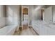 Elegant bathroom featuring a soaking tub and marble countertops at 2259 County Line Rd, Acworth, GA 30101