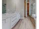 Elegant bathroom with marble vanity, walk-in shower, and luxury vinyl plank flooring at 2259 County Line Rd, Acworth, GA 30101