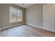 Bright bedroom with wood-look floors and large window at 2259 County Line Rd, Acworth, GA 30101