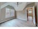 Bedroom with vaulted ceiling, wood-look floors, and walk-in closet at 2259 County Line Rd, Acworth, GA 30101