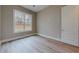 Bright bedroom with large window and wood-look flooring at 2259 County Line Rd, Acworth, GA 30101