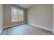 Well-lit bedroom with large window and wood-look floors at 2259 County Line Rd, Acworth, GA 30101