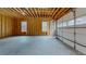 Unfinished garage with concrete floor and garage door at 2259 County Line Rd, Acworth, GA 30101