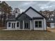 Back of house showing a covered patio and stylish architectural details at 2259 County Line Rd, Acworth, GA 30101